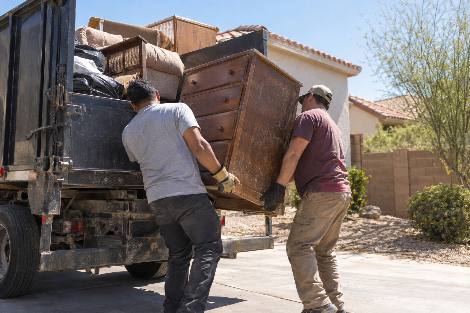 crew loading a junk truck